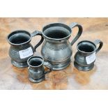 A run of four pewter measures from half pint to quarter gill with inscribed owners name R.