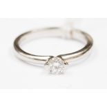 A diamond solitaire platinum ring, the round brilliant cut diamond approx 0.