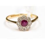 A 9ct yellow and white gold and ruby, diamond flower cluster, size M,