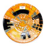A Poole Pottery graphic design dish, orange, yellow and blue colours, approx diameter 26.