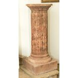 A composite marble effect fluted column plinth