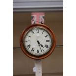 A 19th century mahogany wall clock with a circular dial, black Roman numerals,