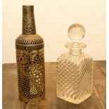 A Victorian glass decanter and fretted metal bottle cage