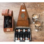 A metronome in wood pyramid shape with a cartouche, Edwardian, s/d and a pair of Christy cups,