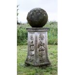 A pair of stone spheres on carved plinths, 19th century,