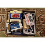 A box of assorted boxed vehicles including Matchbox, Lledo,