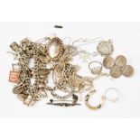 A heavy silver charm bracelet, chains, brooches,