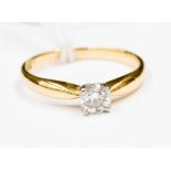 An diamond and 18ct gold ring set with a 0.