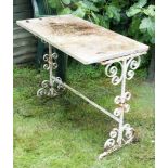 A marble topped wrought iron rectangular table