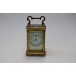 A late 19th Century French repeating carriage clock, brass corniche case,