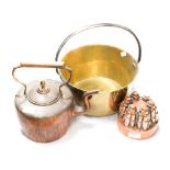 A Victorian copper jelly mold in the form of castle turrets with a copper kettle (acorn finial) and
