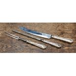 A silver handled three piece carving set