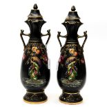 A pair of black Victorian vases with enamelled Oriental decoration (2)