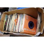 A box of 7" singles including Rolling Stones, Small Faces,