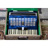 A mid 20th Century 'Parrot' piano accordion, two and a half octaves, blue cased body,