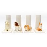 A set of four Sylvac tall cream vases with figures of Dogs to base,