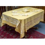 A Secessionist embroidered tablecloth and twelve napkins, in the style of Peter Behrens, circa 1900,