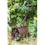 An iron lawn roller,