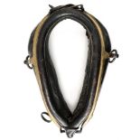 A leather horse collar,