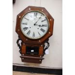 A mahogany veneered 8 day wall clock with inlaid mother of pearl Roman numerals