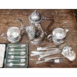 A collection of silver plate including a Victoria style coffee pot,