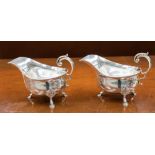 A pair of silver sauce boats, George II style with open acanthus C scroll handles,
