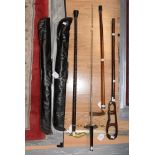 Two cased snooker cues,