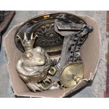 A collection of metalware including chamber sticks, alms dish, stirrups, spurs, trophies,