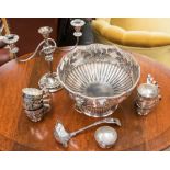 A silver plate on copper footed punch bowl with matching punch ladle and twelve matching punch cups,