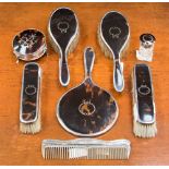 A silver mounted tortoiseshell backed brush set, probably Birmingham 1921,