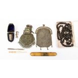 A cased silver thimble, two white metal chain mail purses, one with paste stone,