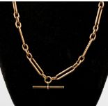 A 9ct rose gold Albert with oval and elongated links and swivel clasp and T bar,