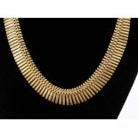 A 9ct gold Cleopatra style necklace with a length of approx 16'', with a weight approx 23.