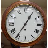 A circular mahogany wall clock, Roman numerals, from the Derby Co-op Boot Factory, Victory Road,