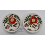 A pair of Moorcroft 1st quality coasters in the Scotch Rose pattern, designed by Nicola Slaney,