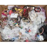 A box of costume jewellery, bangles, brooches, necklace,