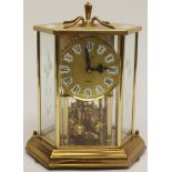 A 1950s Anniversary clock lacquered brass