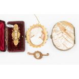A Victorian 15ct gold bar brooch in original box, a Victorian yellow metal cameo design bar brooch,