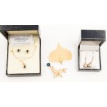 An 9ct gold chain with a Sapphire and Diamond pendant, with matching stud earrings,