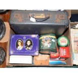 A KLM attache case and a collection of tins