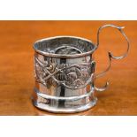 An embossed silver demitasse sleeve, dated 1904,