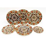 Four Imari Crown Derby dinner plates 1128 pattern including tow others