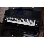 A Technics KN3000 keyboard with stand,