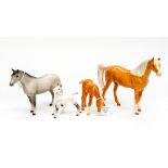 Four Beswick horses, comprising Palamino horse and foal,