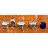 A silver Mappin and Webb four piece cruet set (including EP salt spoon and one Bristol blue liner)