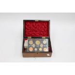 A wooden boxed collection of various Commemorative coins to include Thoresby Hall coins,