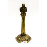 An Art Nouveau brass Palmer and Co candlestick, foliate moulded with spring loaded sconce,
