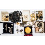 A bag of costume jewellery including a Ruskin (Kensington brooch) af crack to the centre,