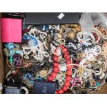 A large box of assorted costume jewellery, a bag of rings,