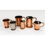 A group of Victorian copper mugs,